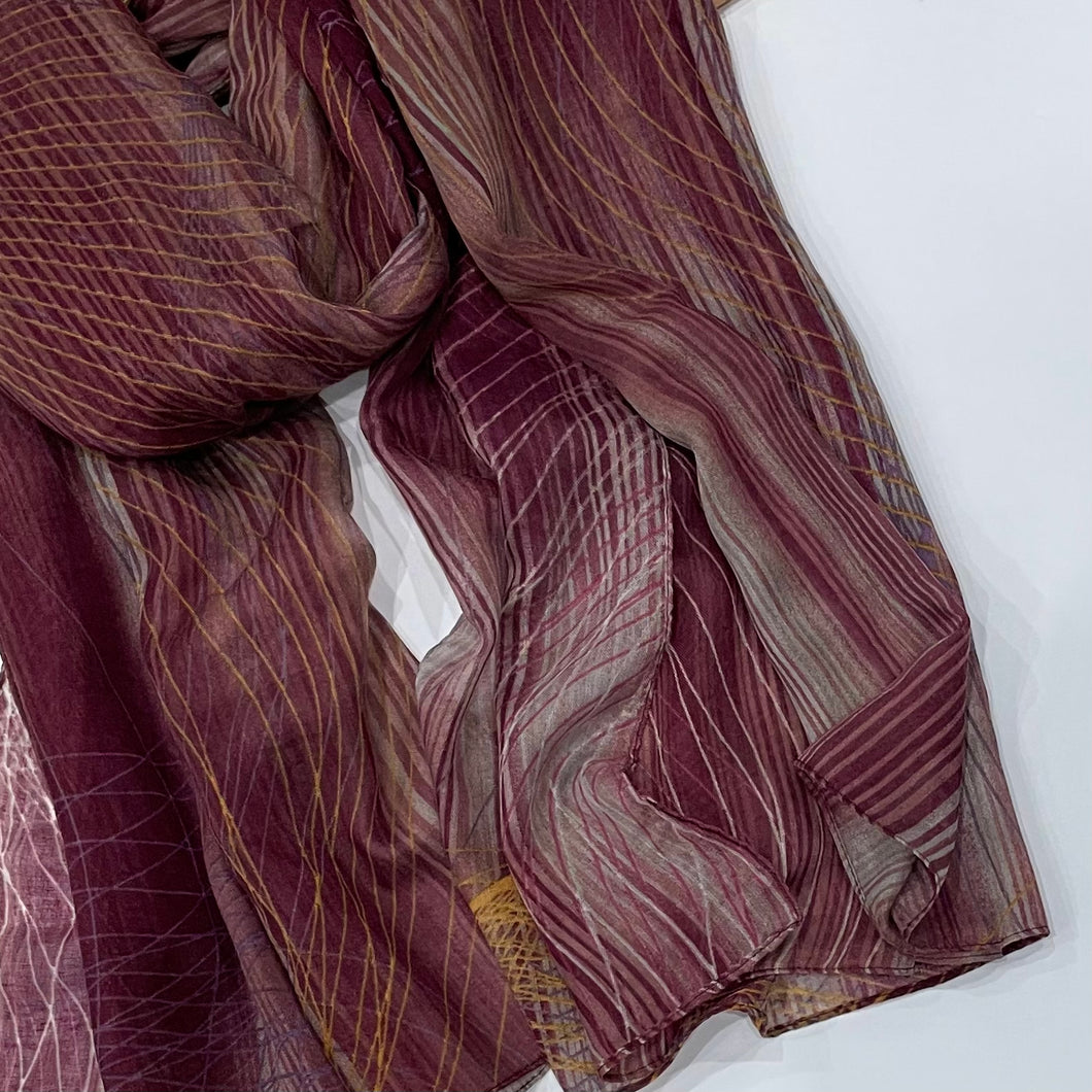 This Plum Printed Hijab adds a subtle pop of color with its mix of mustard and purple, all featured on an abstract print. Its lightweight material provides a comfortable fit and a stylish look.