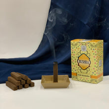 Load image into Gallery viewer, No Charcoal , No Eleectric Burner !  These Oud/bakhoor sticks are easy to use. The set comes with a metal tray and 10 Oud/bakhoor sticks.   Just light the stick as shown in the sample video, let it burn for 10-15 seconds and then turn off the flame as shown, and the stick will burn and the burnt Oud/bakhoor will collect in the tray  enjoy the beautiful scent  one stick will burn for about 15-20 minutes    
