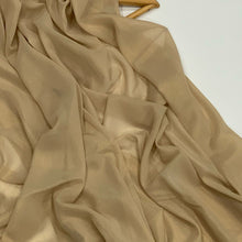 Load image into Gallery viewer, Gold Shimmer Chiffon Hijab  https://www.arifasboutique.com/products/gold-shimmer-chiffon-hijab  Shimmer Chiffon Hijabs are the perfect balance of style and shine. The perfect piece to compliment your outfit for any occasion Material: 100% Polyester&nbsp; Size: 180 cm x 70 cm Color may look different due to different screen resolution&nbsp;
