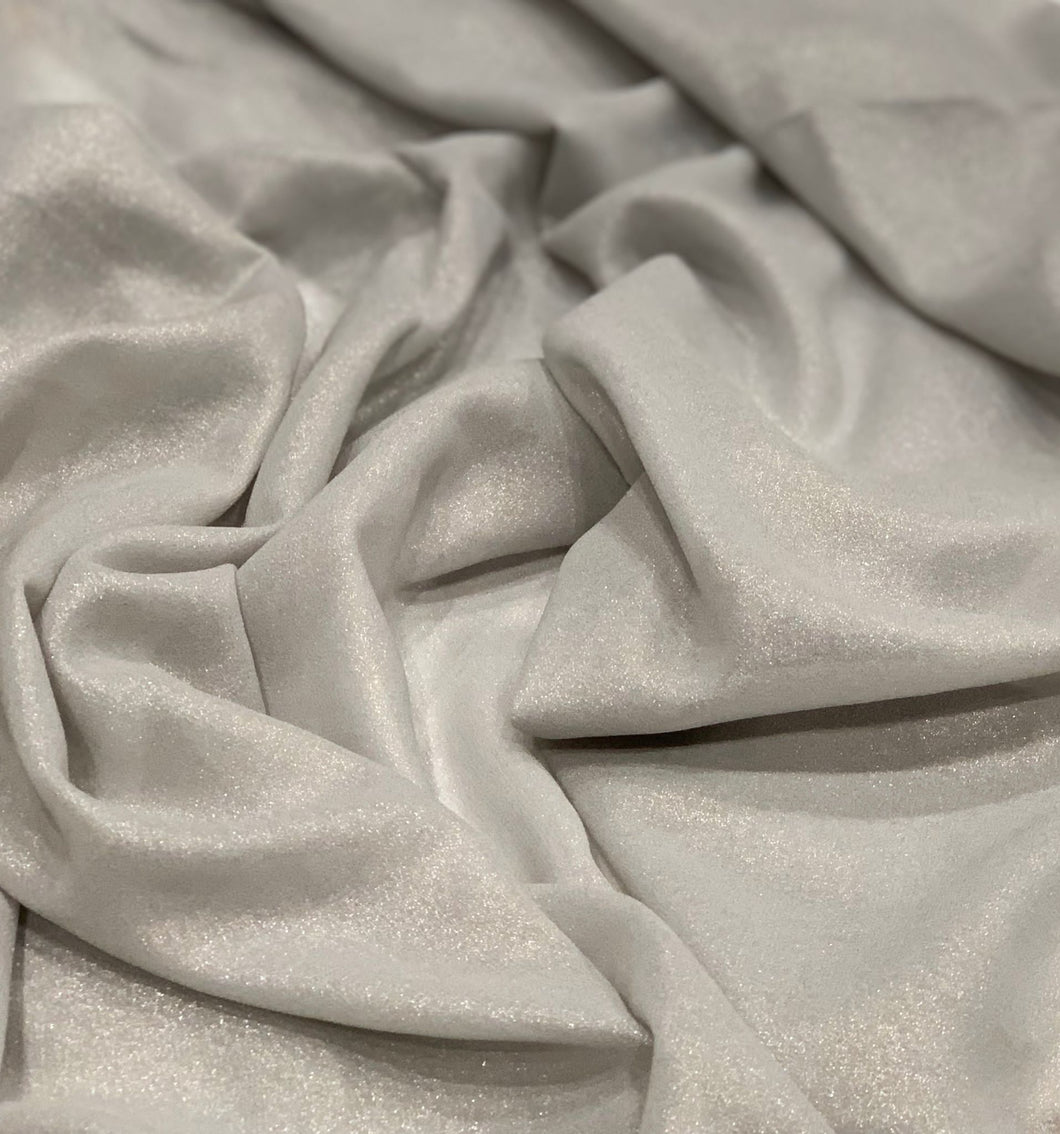 Silver Shimmer Chiffon Hijab scarf  https://www.arifasboutique.com/products/silver-shimmer-chiffon-hijab  Shimmer Chiffon Hijabs are the perfect balance of style and shine. The perfect piece to compliment your outfit for any occasion. Material: 100% Polyester Size: 180 cm x 70 cm Color may look different due to different screen resolution