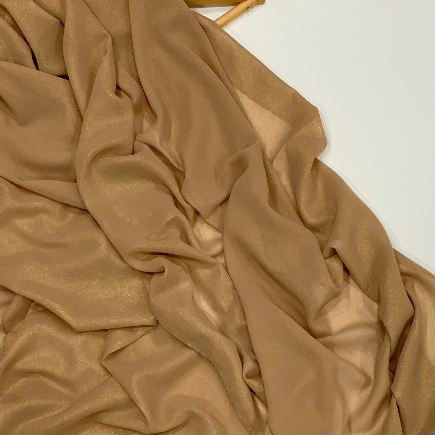 Dark Gold Shimmer Chiffon Hijab  https://www.arifasboutique.com/products/beige-gold-shimmer-chiffon-hijab  Shimmer Chiffon Hijabs are the perfect balance of style and shine. The perfect piece to compliment your outfit for any occasion Material: 100% Polyester Size: 180 cm x 70 cm 